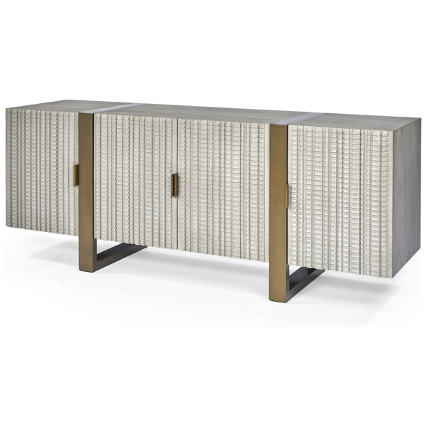 The Bandini Low Cabinet in London Grey Fog with Finished Aged Brass sits in a studio.