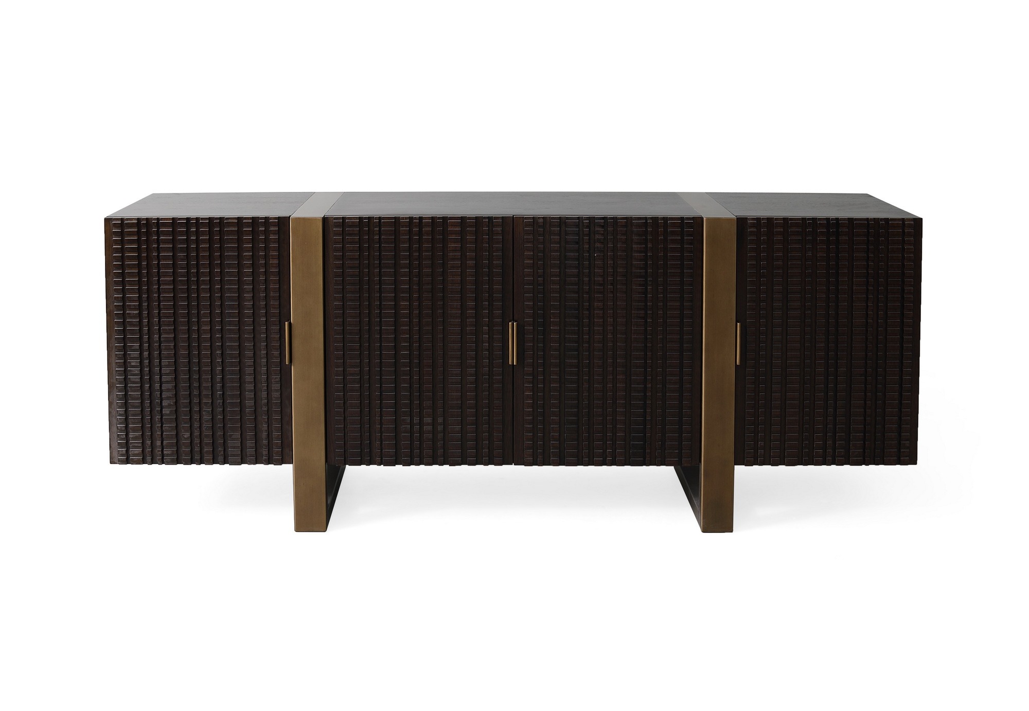 The Bandini Low Cabinet in Dark Walnut with Finished Aged Brass sits in a studio.