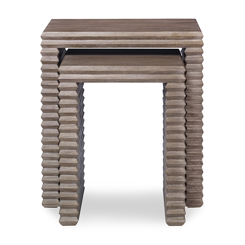 The Belmont Nesting Table in Rustic Grey Pine sits in a studio.