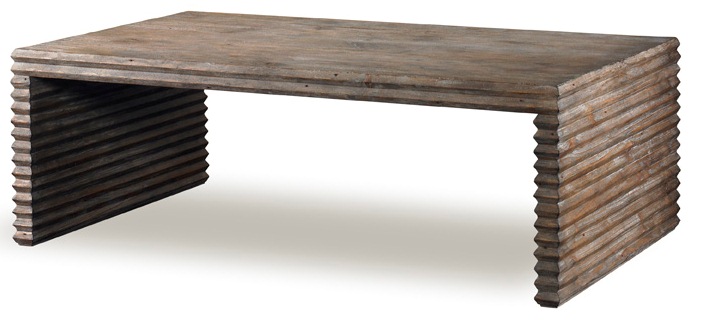 The Belmont Coffee Table in Rustic Grey Pine sits in a studio.