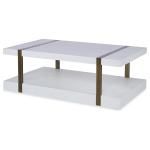 The Mercer Coffee Table in Smooth White Gesso with Finished Aged Brass sits in a studio.