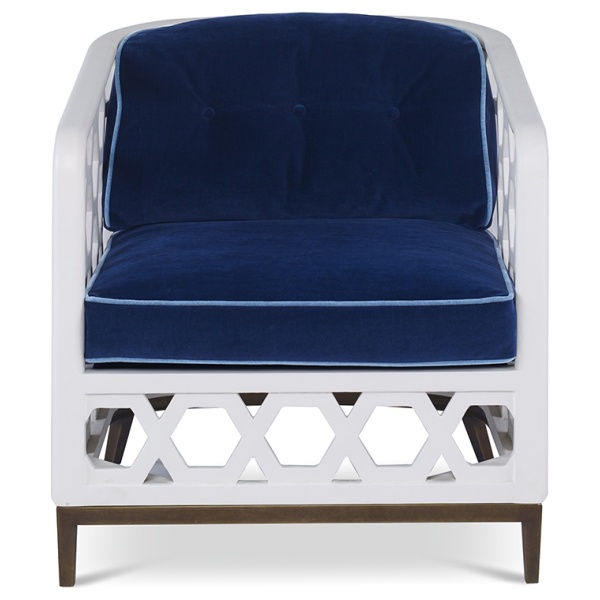 The Wilhelm Chair in Santorini White and Lapis Blue Velvet sits in a studio